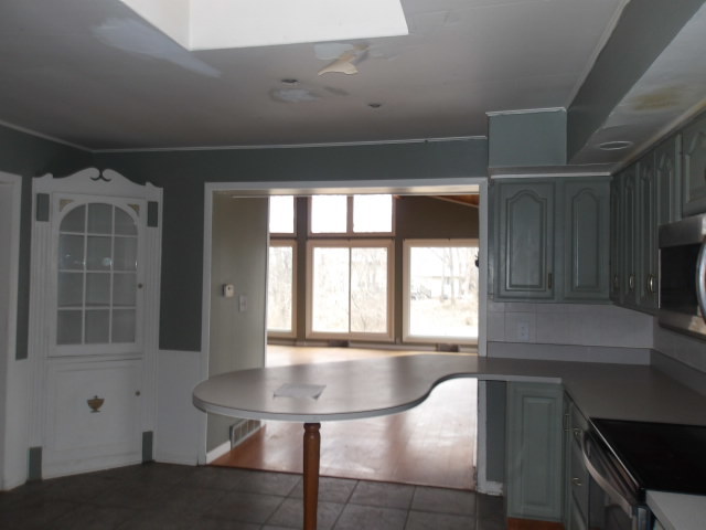 13 Southern Drive Decatur, IL 62521 - Photo 9 of 29 a kitchen with a window a sink and a table
