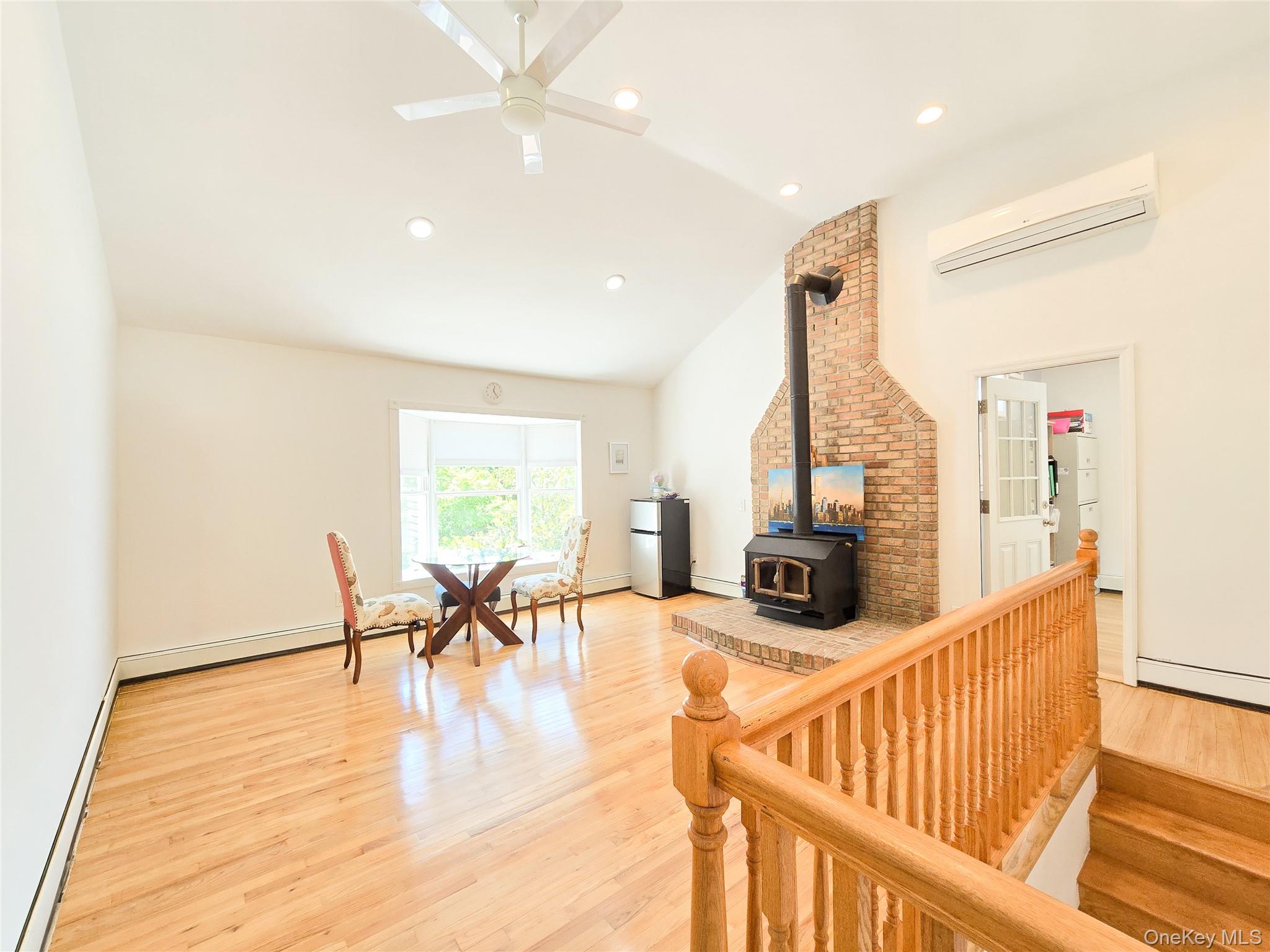 249 Cold Spring Road Syosset, NY 11791 - Photo 12 of 28 a view of a dining room with furniture one side kitchen view and wooden floor