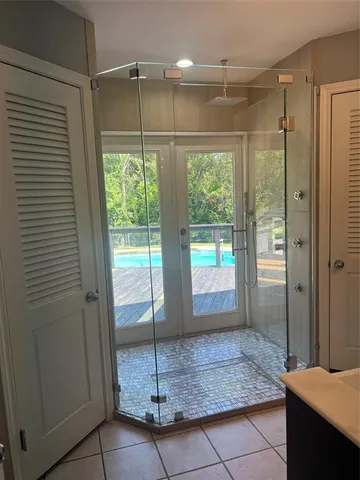 a bathroom with a shower and a sink
