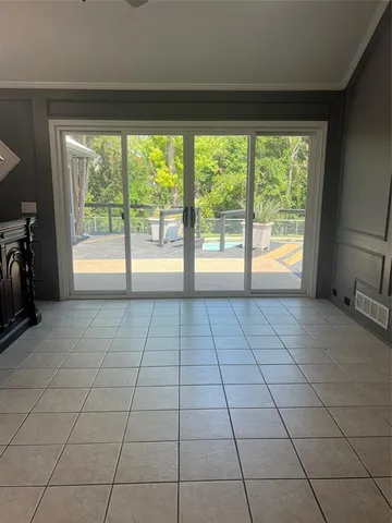 a view of an empty room and window