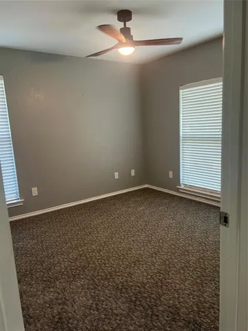 an empty room with a empty space and a window