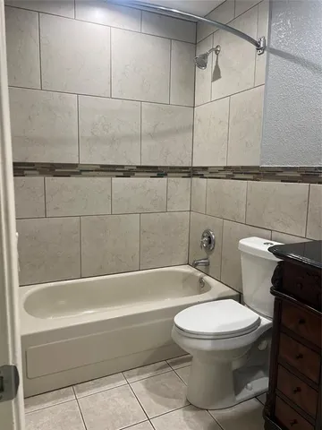 a bathroom with a sink a mirror and shower