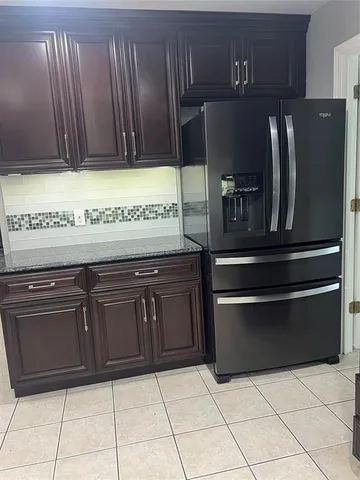 a kitchen with granite countertop stainless steel appliances and cabinets