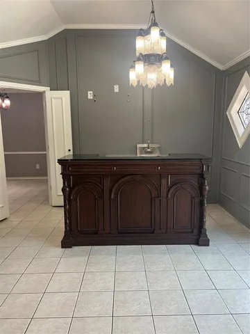 a spacious bathroom with a sink and a mirror