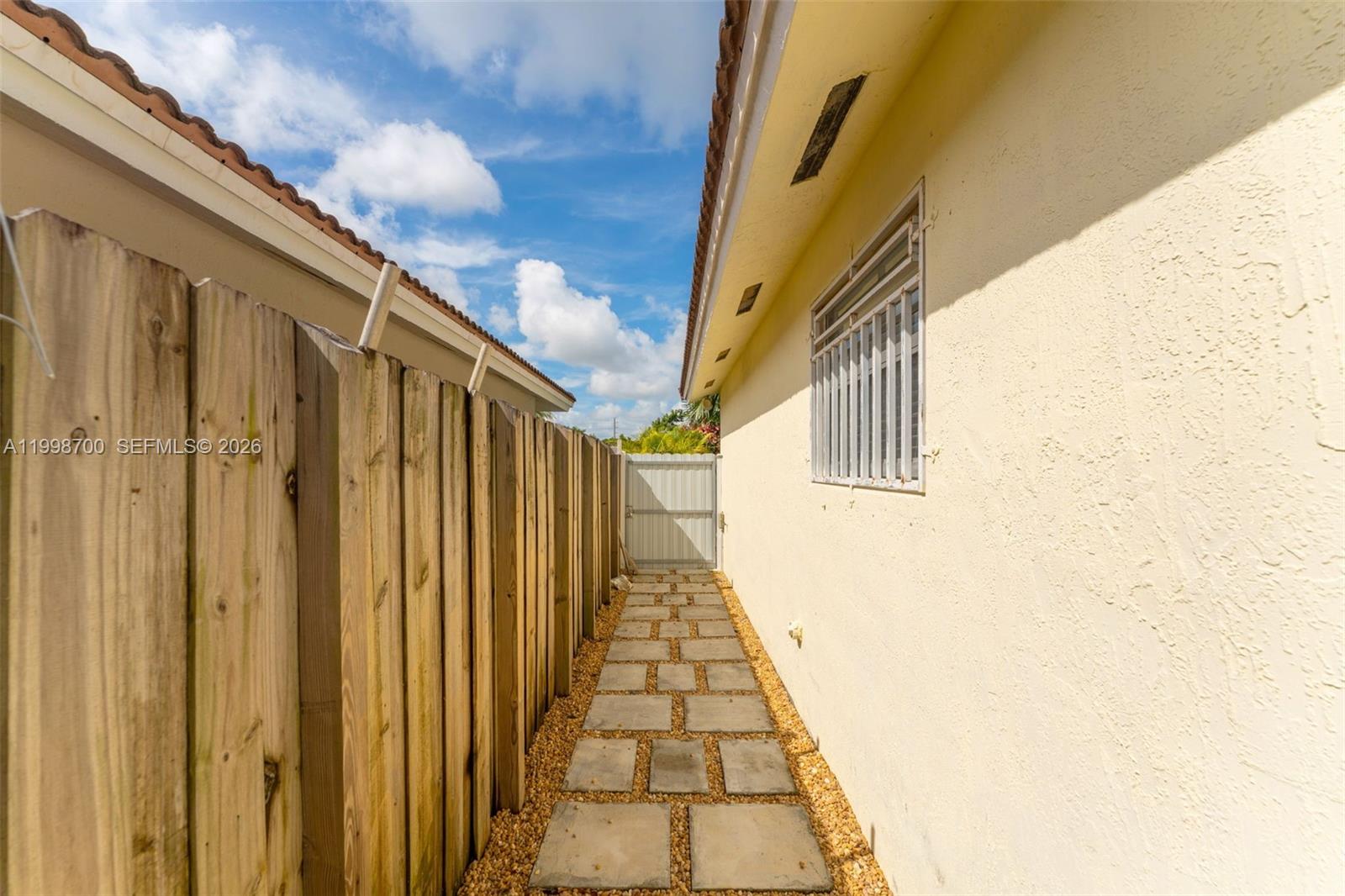 13471 Southwest 278th Terrace Homestead, FL 33032 - Photo 12 of 32 a view of a pathway of a building
