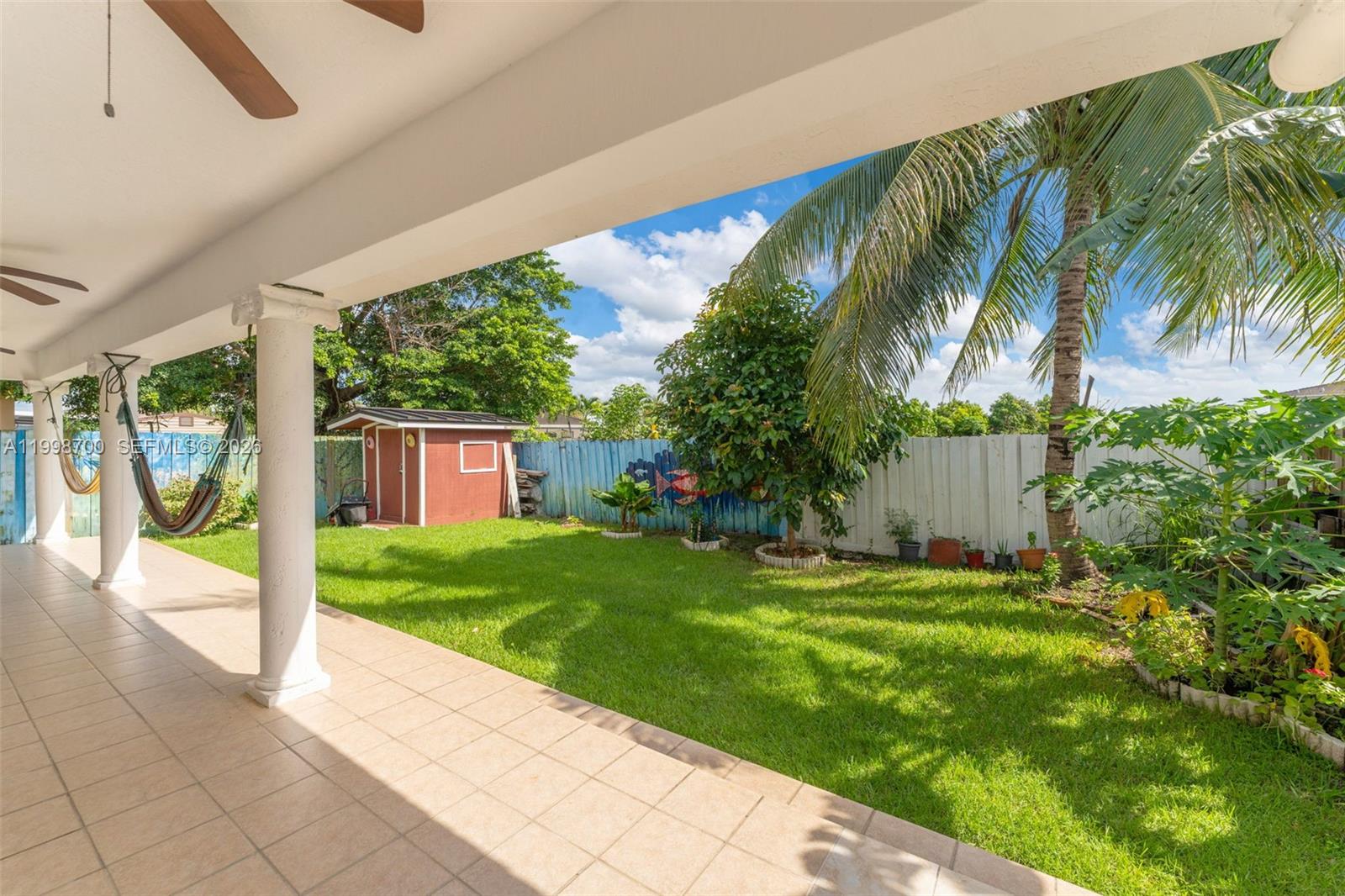 13471 Southwest 278th Terrace Homestead, FL 33032 - Photo 15 of 32 a view of a yard with palm trees