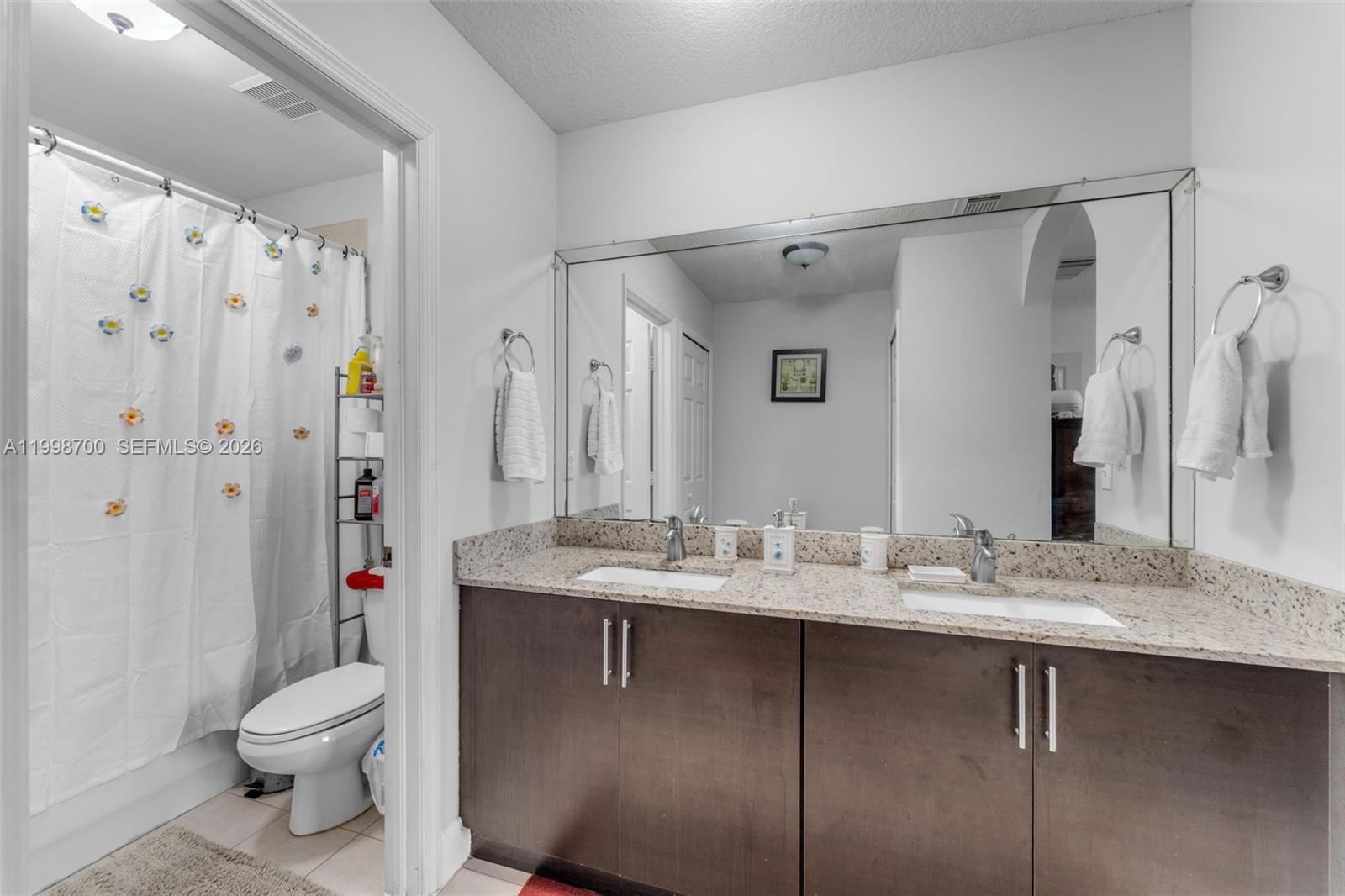 13471 Southwest 278th Terrace Homestead, FL 33032 - Photo 19 of 32 a bathroom with a sink toilet and shower