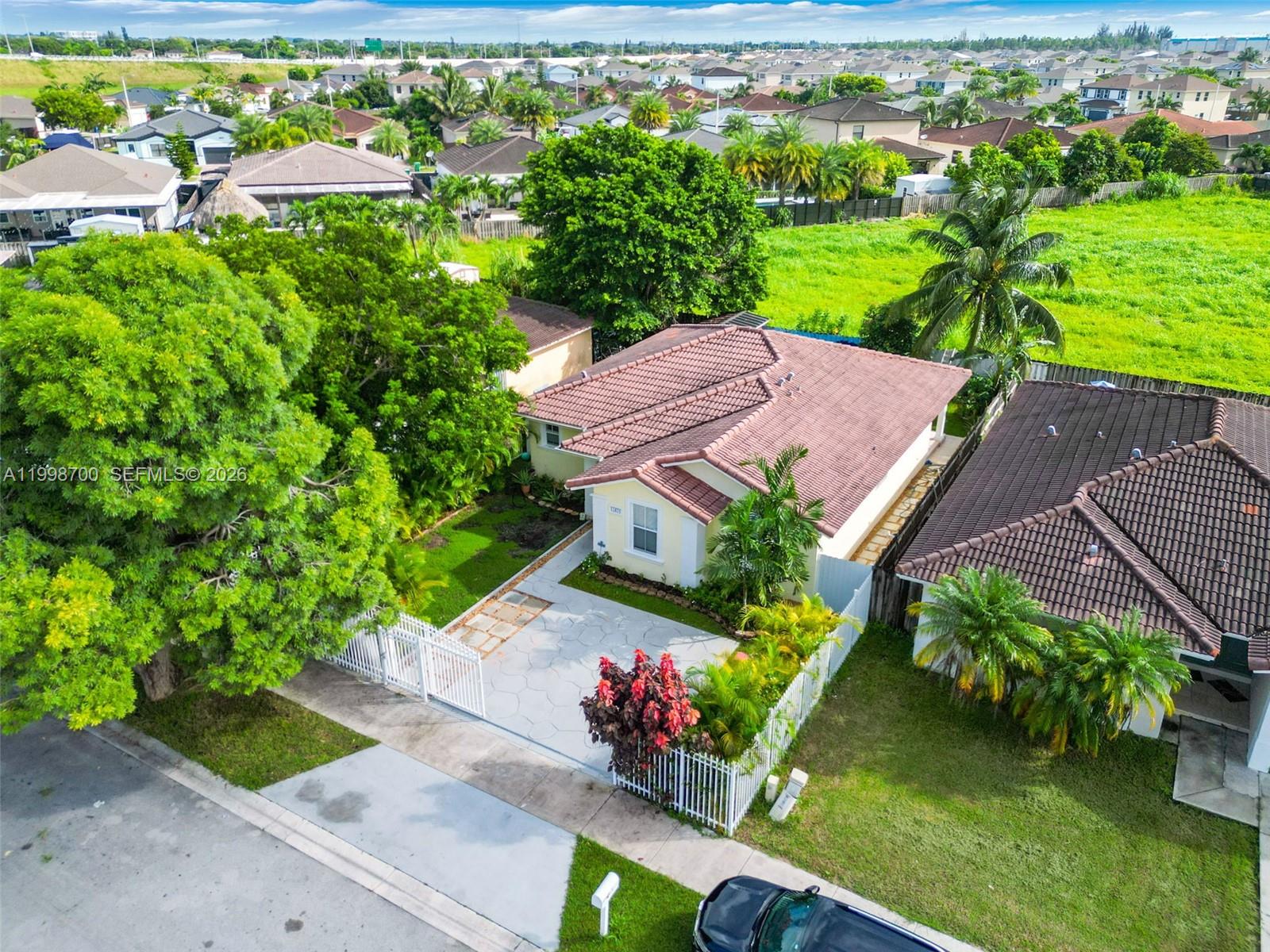 13471 Southwest 278th Terrace Homestead, FL 33032 - Photo 2 of 32 an aerial view of a house