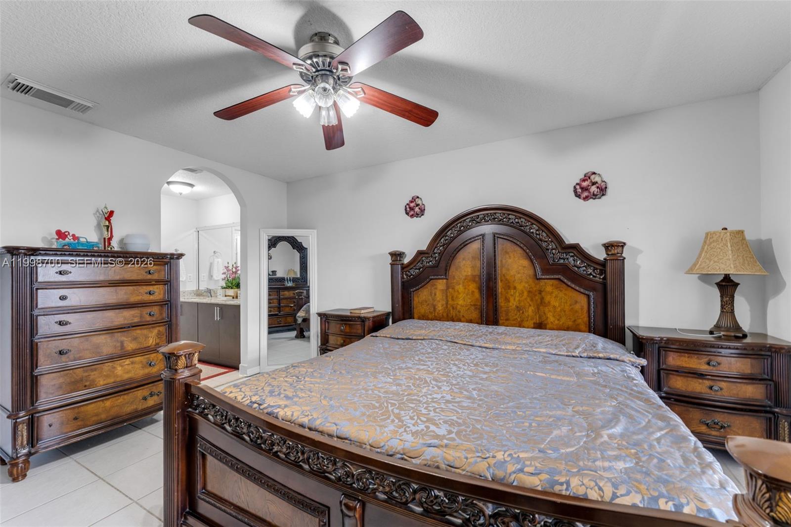 13471 Southwest 278th Terrace Homestead, FL 33032 - Photo 21 of 32 a bedroom with a bed and a dresser