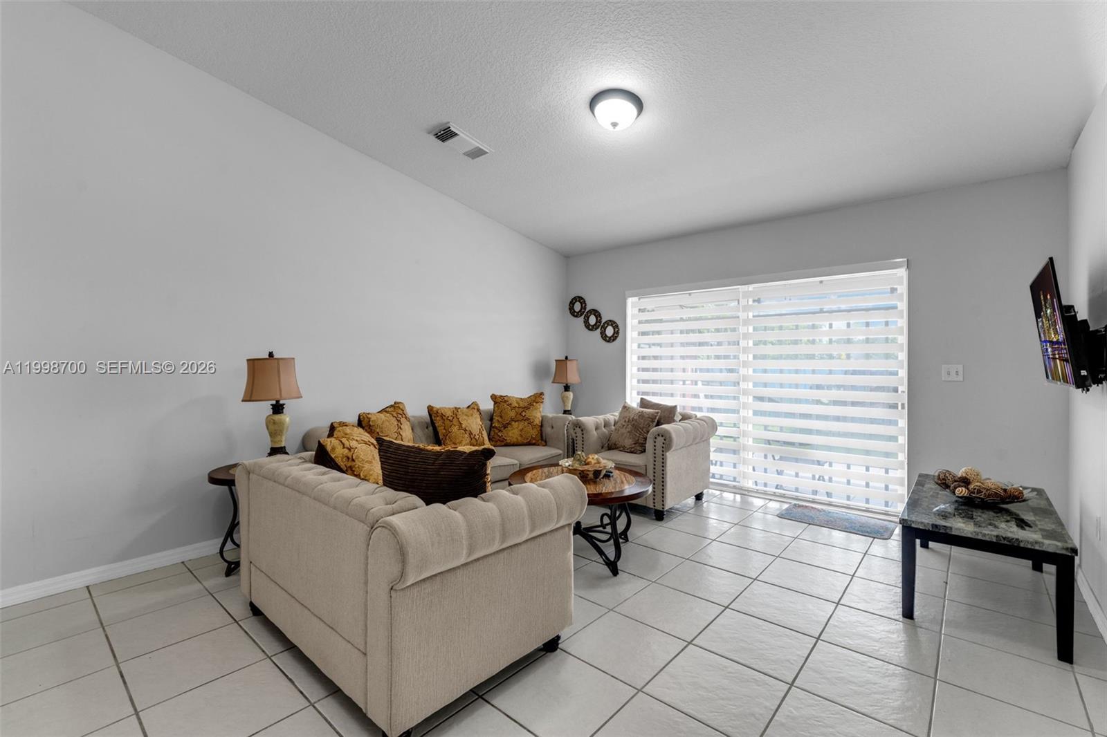 13471 Southwest 278th Terrace Homestead, FL 33032 - Photo 29 of 32 a living room with furniture and a couch