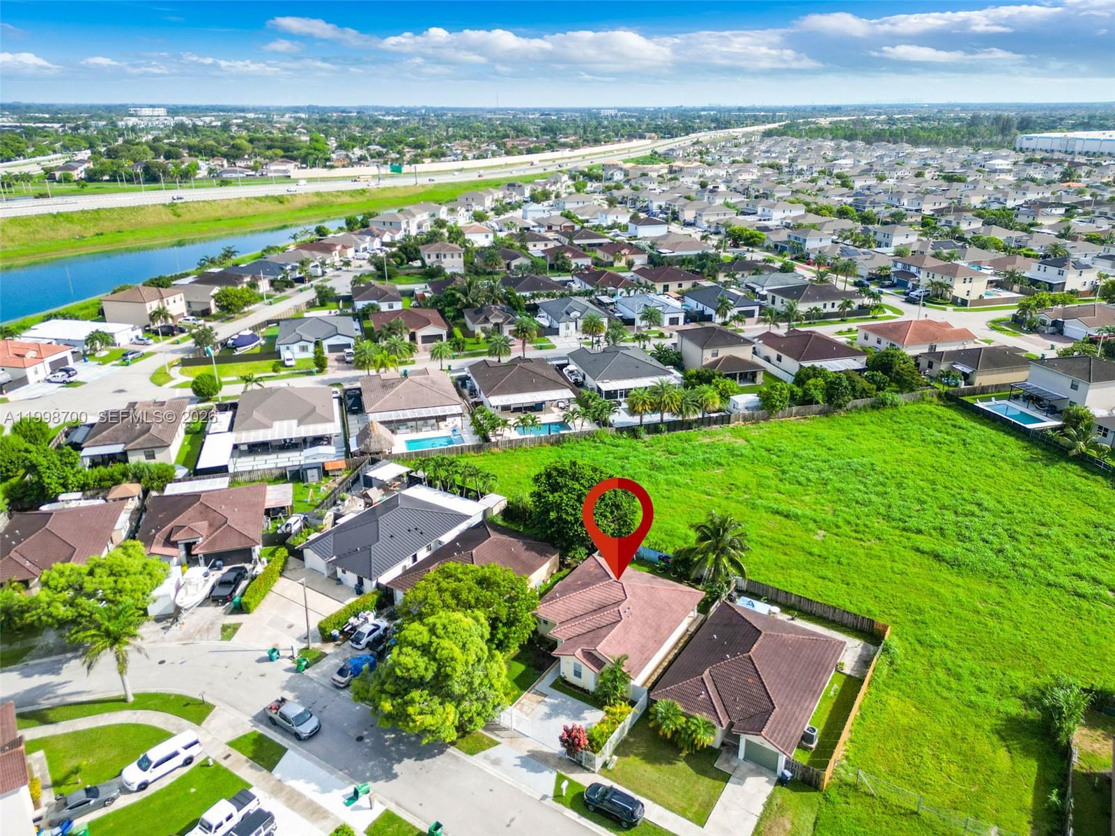 13471 Southwest 278th Terrace Homestead, FL 33032 - Photo 6 of 32 an aerial view of residential houses with outdoor space