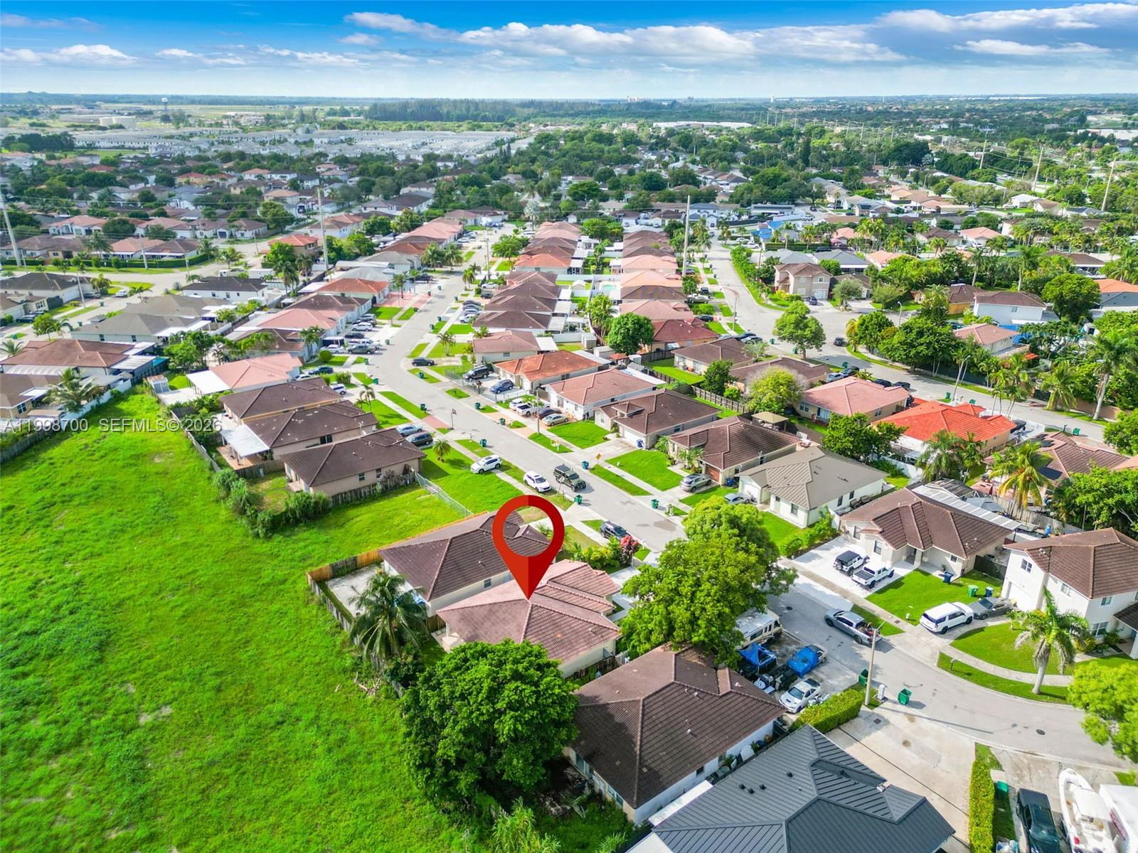 13471 Southwest 278th Terrace Homestead, FL 33032 - Photo 8 of 32 an aerial view of residential houses with outdoor space and street view