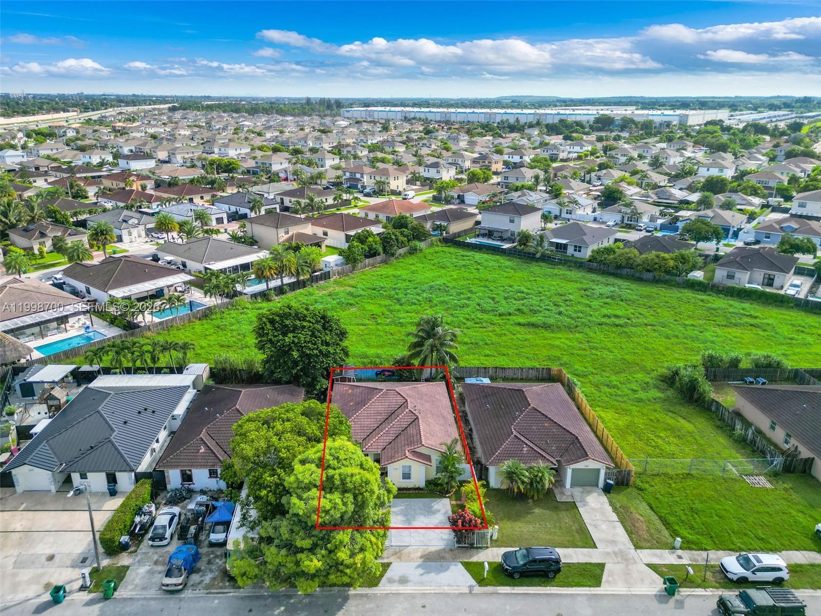 13471 Southwest 278th Terrace Homestead, FL 33032 - Photo 10 of 32 an aerial view of residential houses with outdoor space and trees