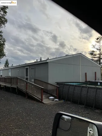 a view of a roof deck with wooden fence