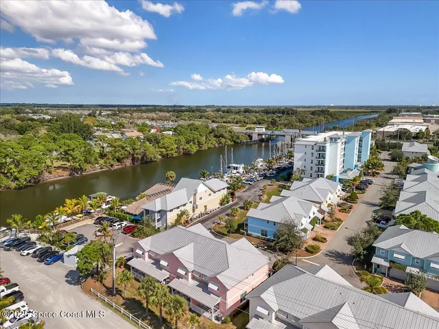 an aerial view of ocean with residential house with outdoor space