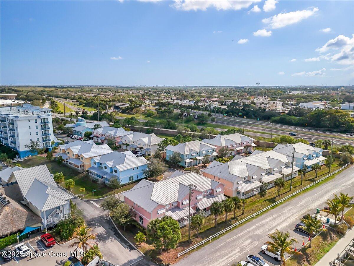 2730 Cutlass Point Lane, Unit 101 Merritt Island, FL 32953 - Photo 26 of 31 an aerial view of a city with lawn chairs