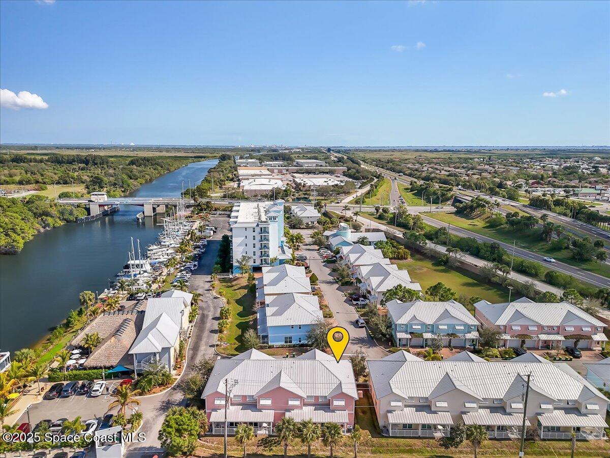 2730 Cutlass Point Lane, Unit 101 Merritt Island, FL 32953 - Photo 27 of 31 an aerial view of a city with houses