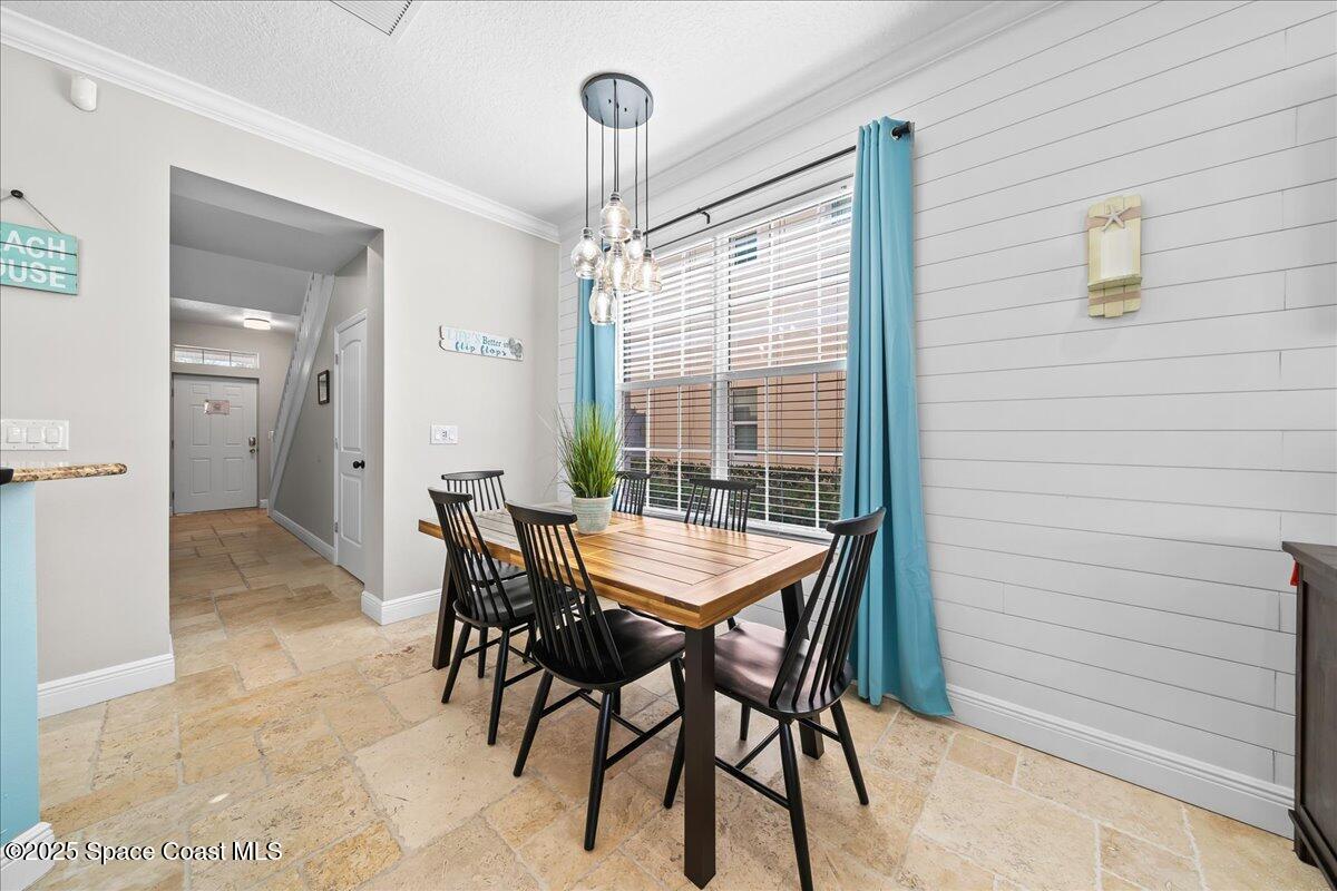 2730 Cutlass Point Lane, Unit 101 Merritt Island, FL 32953 - Photo 4 of 31 a dining room with furniture and window