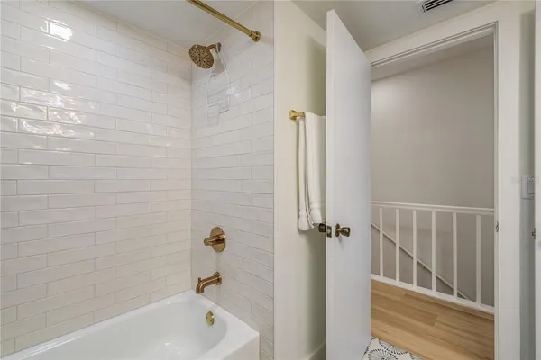 a bedroom with a bed and large window