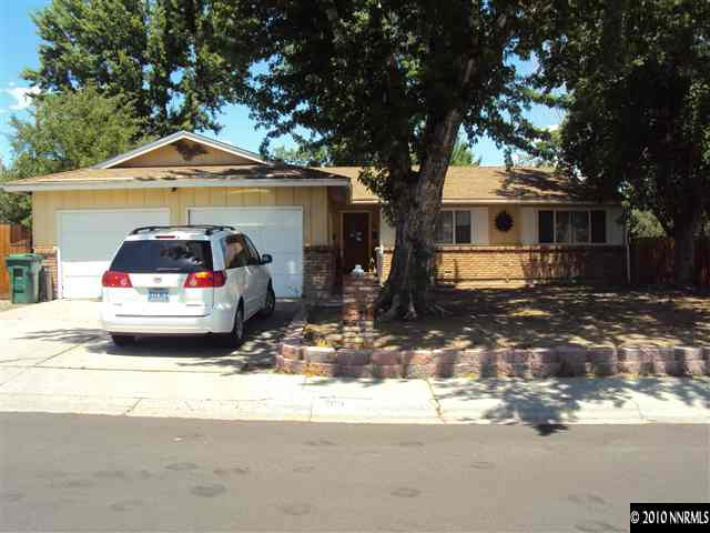 2115 Royal Drive Reno, NV 89503 - Photo 1 of 1 a car parked in front of a white house
