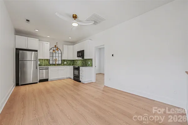 a view of kitchen with wooden floor