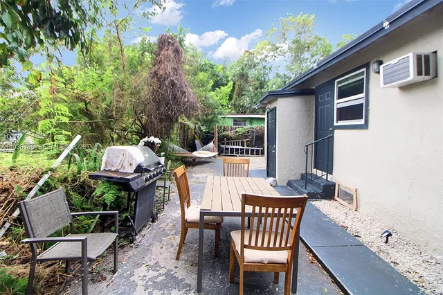 a view of a chairs and table in patio