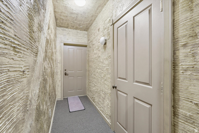 560 East 700 North Logan, UT 84321 - Photo 25 of 32 Entryway featuring textured wall finishes and neutral-toned four-panel doors