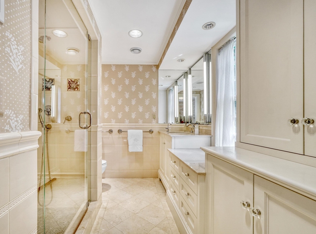 97 Rutledge Road Belmont, MA 02478 - Photo 17 of 42 a bathroom with a tub sink shower and mirror
