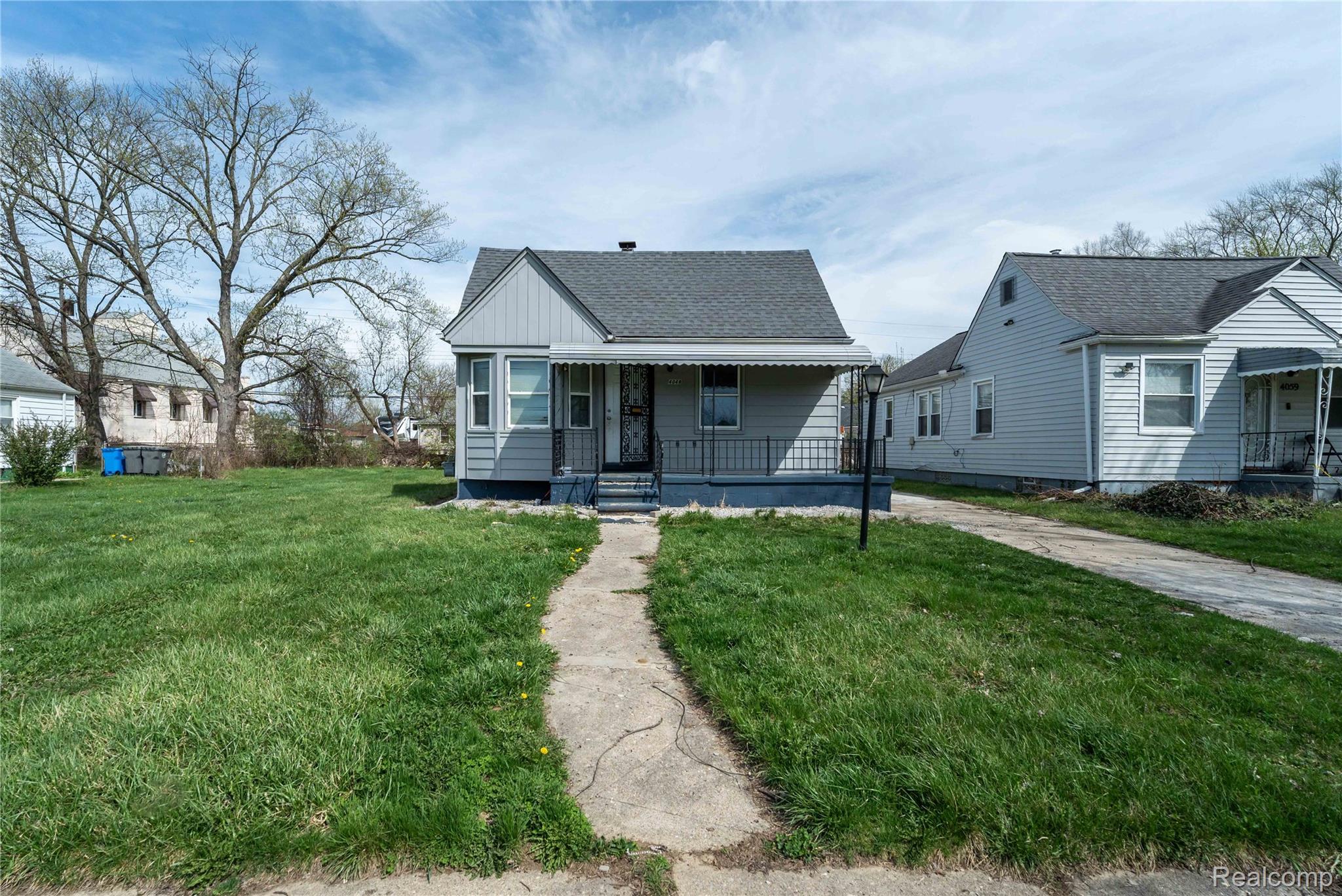 4049 Williams Street Inkster, MI 48141 - Photo 1 of 21 Bungalow-style home with a front yard, a porch, and a shingled roof