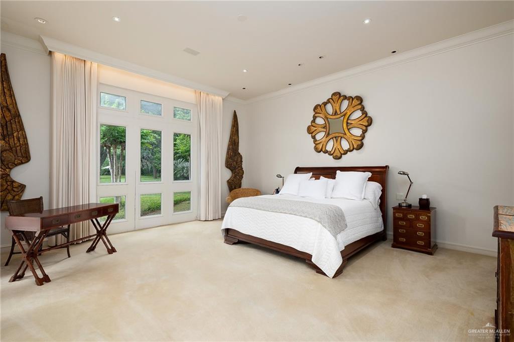 9 Old Orchard Road McAllen, TX 78503 - Photo 20 of 34 a spacious bedroom with a bed and a large window