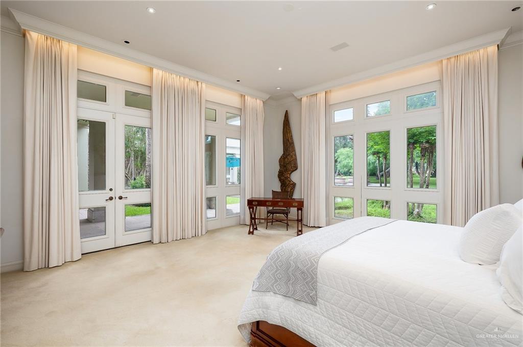 9 Old Orchard Road McAllen, TX 78503 - Photo 21 of 34 a bedroom with a large bed and a large window