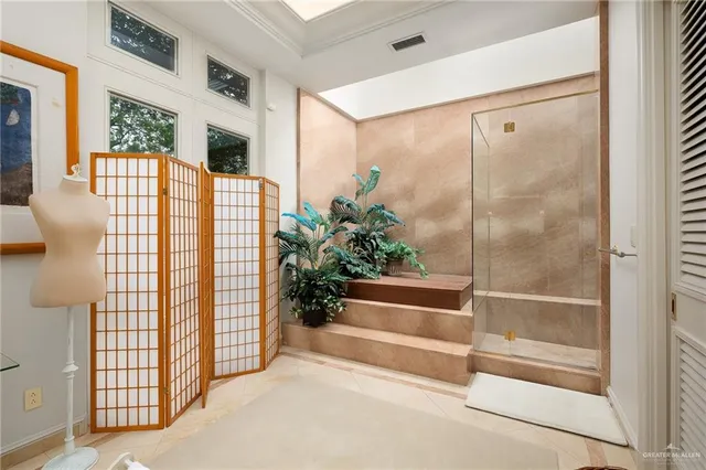 a bathroom with a shower and a sink