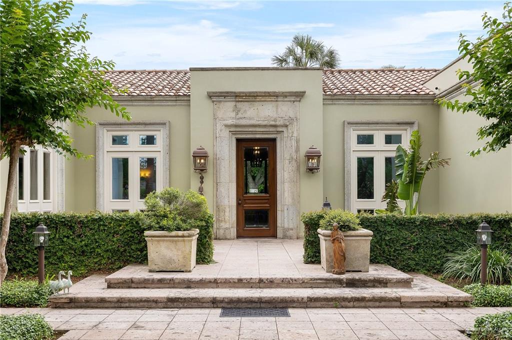 9 Old Orchard Road McAllen, TX 78503 - Photo 7 of 34 a house view with a potted plant in front of it