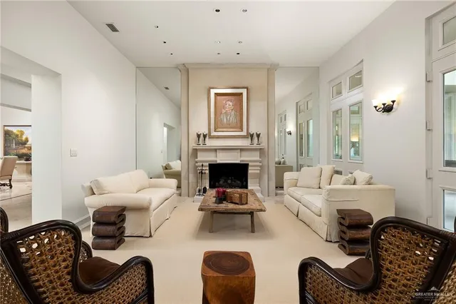 a living room with furniture and fireplace