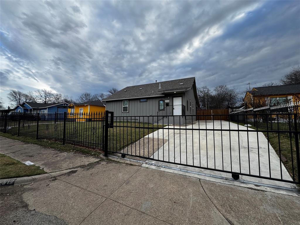 a view of a wrought iron fences in front of house
