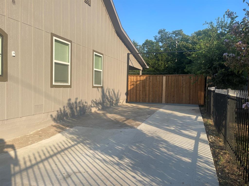 2512 East Overton Road Dallas, TX 75216 - Photo 19 of 21 a view of a house with a backyard