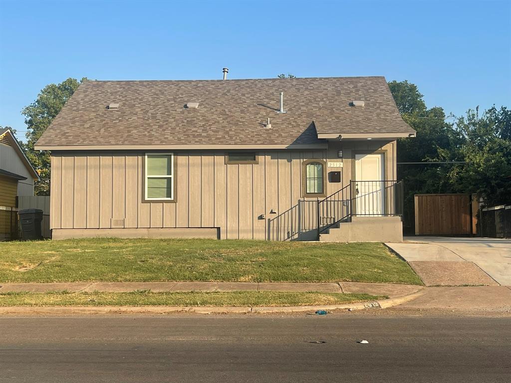 2512 East Overton Road Dallas, TX 75216 - Photo 20 of 21 a front view of a house with a garden and yard