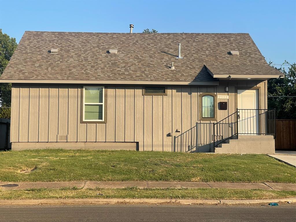 2512 East Overton Road Dallas, TX 75216 - Photo 2 of 21 a front view of a house with a garden