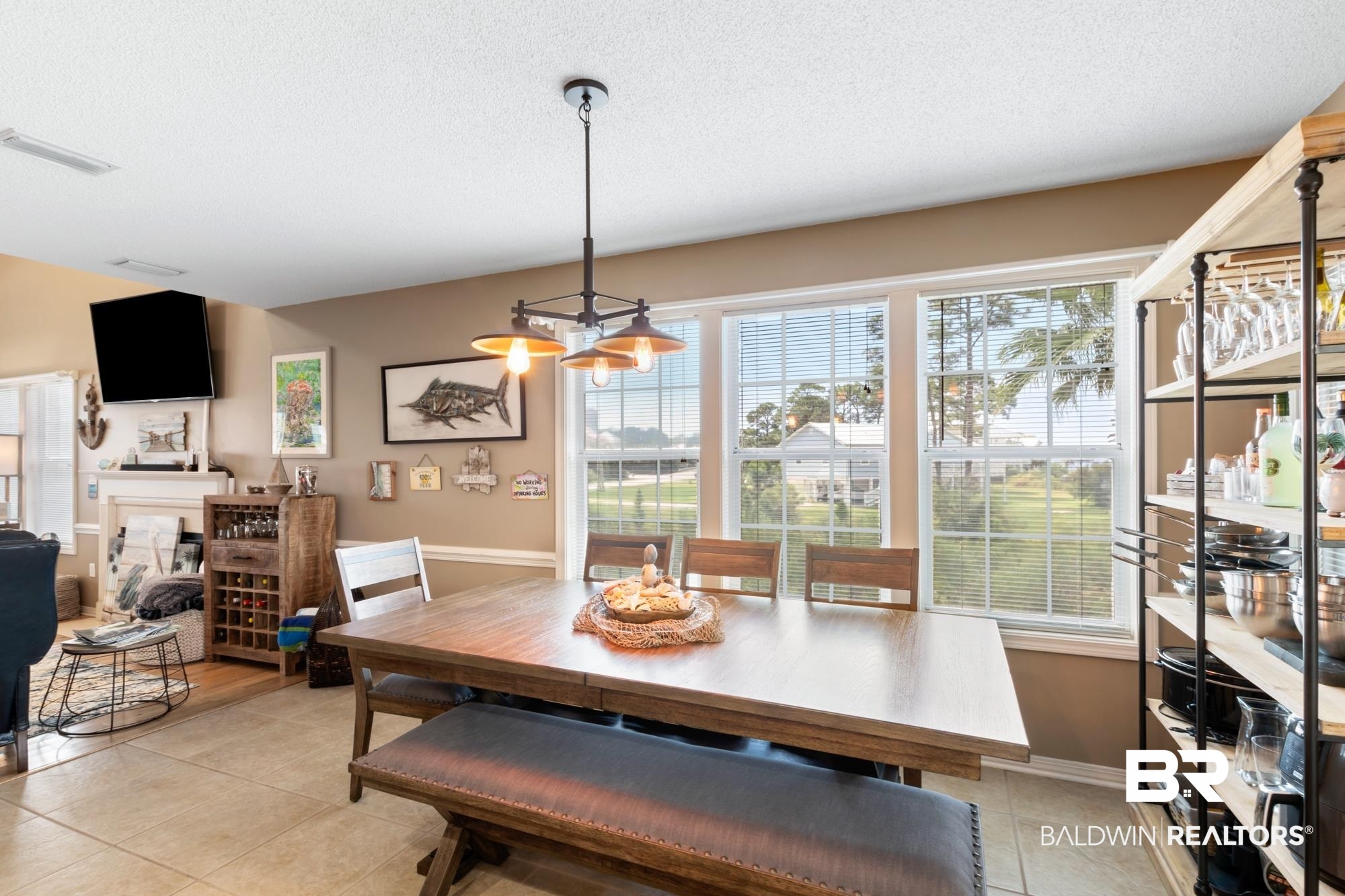 328 Windmill Ridge Road Gulf Shores, AL 36542 - Photo 13 of 47 Tiled dining area featuring a textured ceiling and a chandelier
