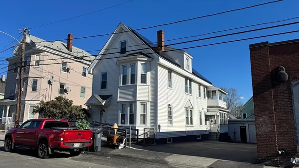 a car parked in front of a house