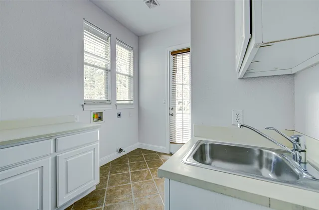 a kitchen that has a sink and a window