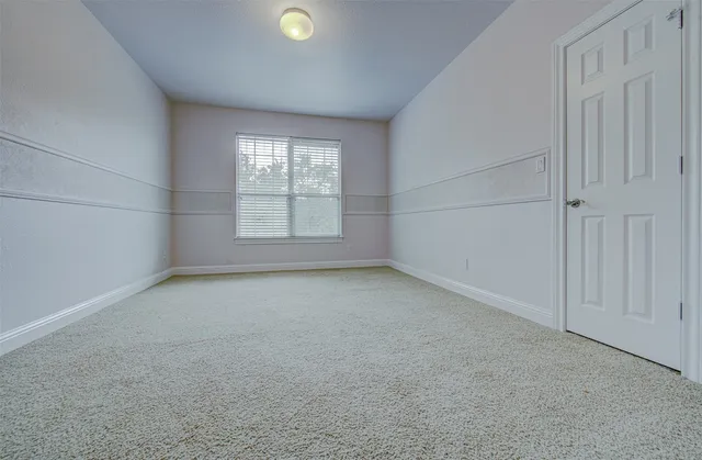 an empty room with a empty space and windows