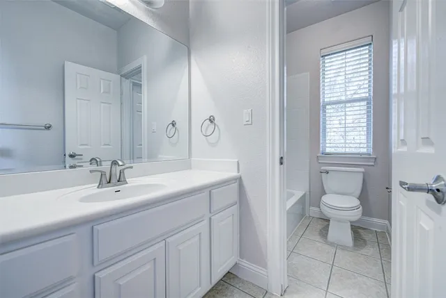 a view of a playground with a tree and plants