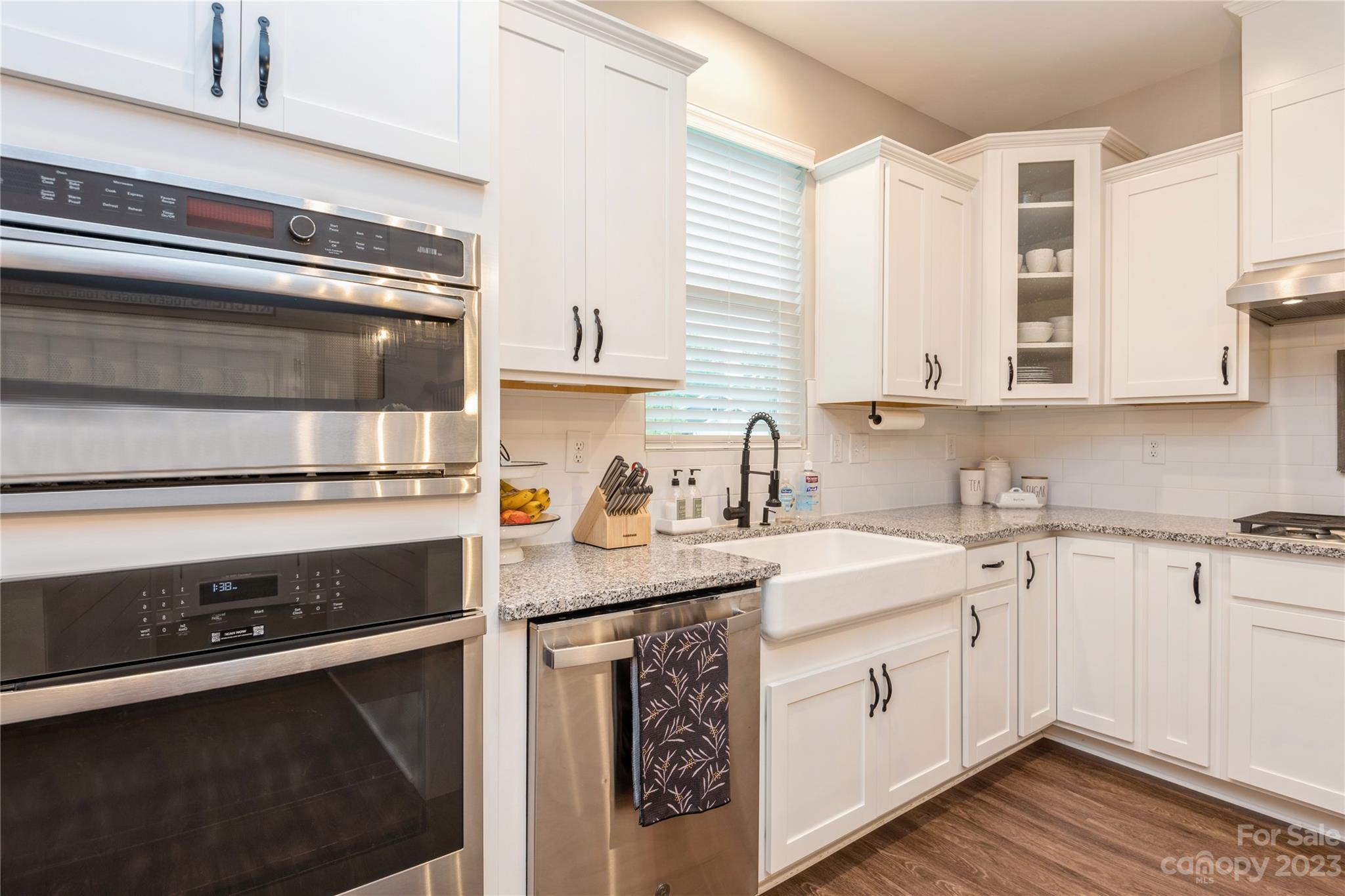 3028 Eagle Ridge Lane Indian Trail, NC 28079 - Photo 11 of 38 a kitchen with a sink stove and cabinets