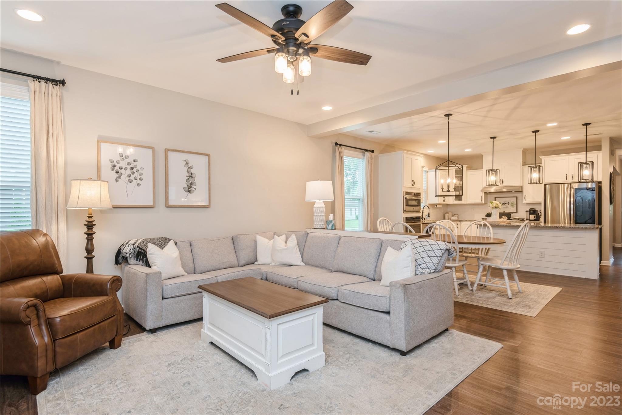 3028 Eagle Ridge Lane Indian Trail, NC 28079 - Photo 17 of 38 a living room with furniture and a large window