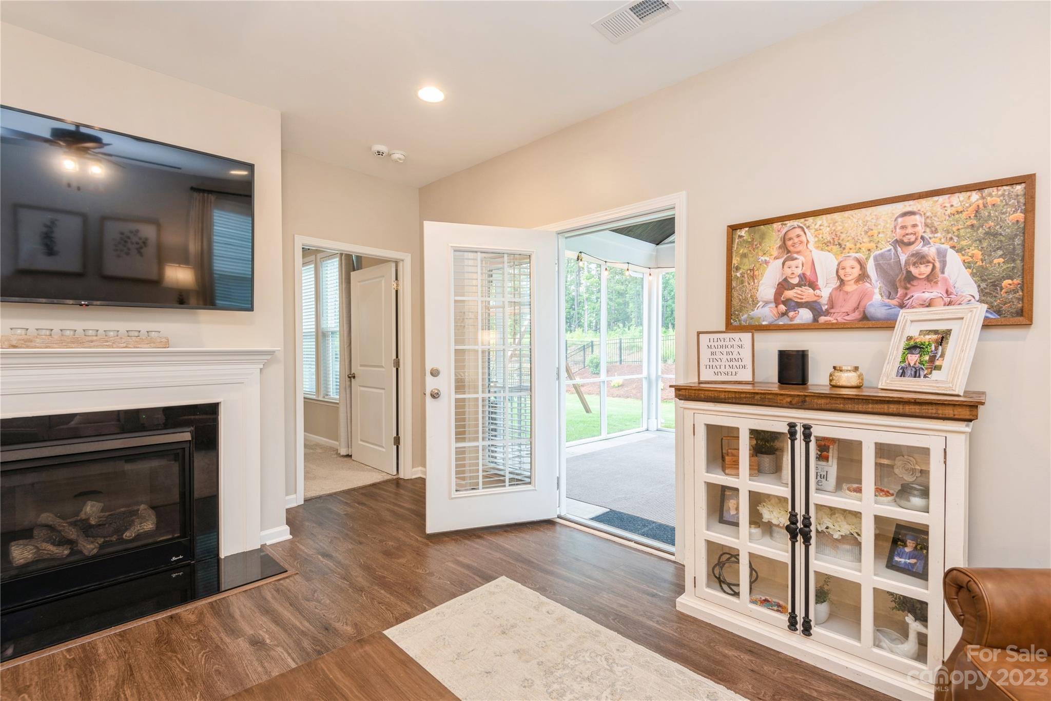 3028 Eagle Ridge Lane Indian Trail, NC 28079 - Photo 19 of 38 a living room with furniture fireplace and flat screen tv