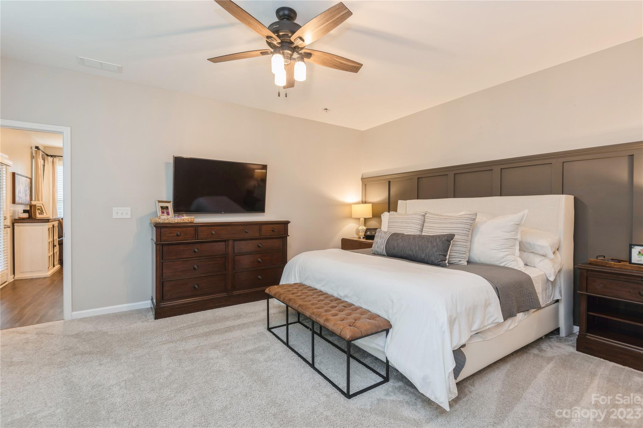 3028 Eagle Ridge Lane Indian Trail, NC 28079 - Photo 21 of 38 a bedroom with a bed and a flat screen tv