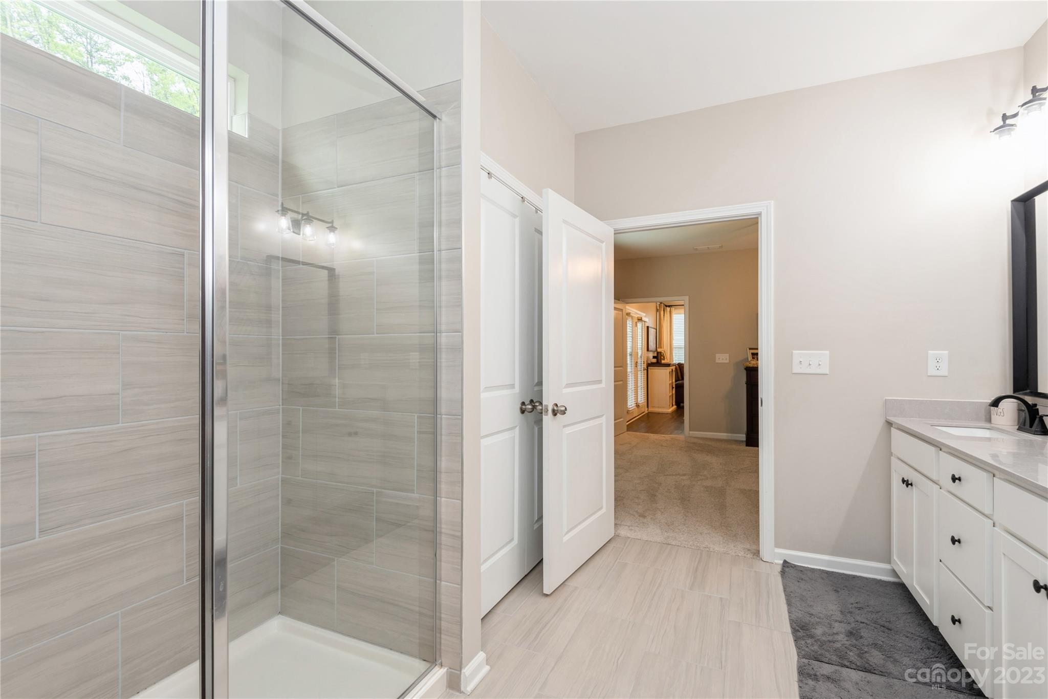 3028 Eagle Ridge Lane Indian Trail, NC 28079 - Photo 23 of 38 a view of a bathroom from a hallway