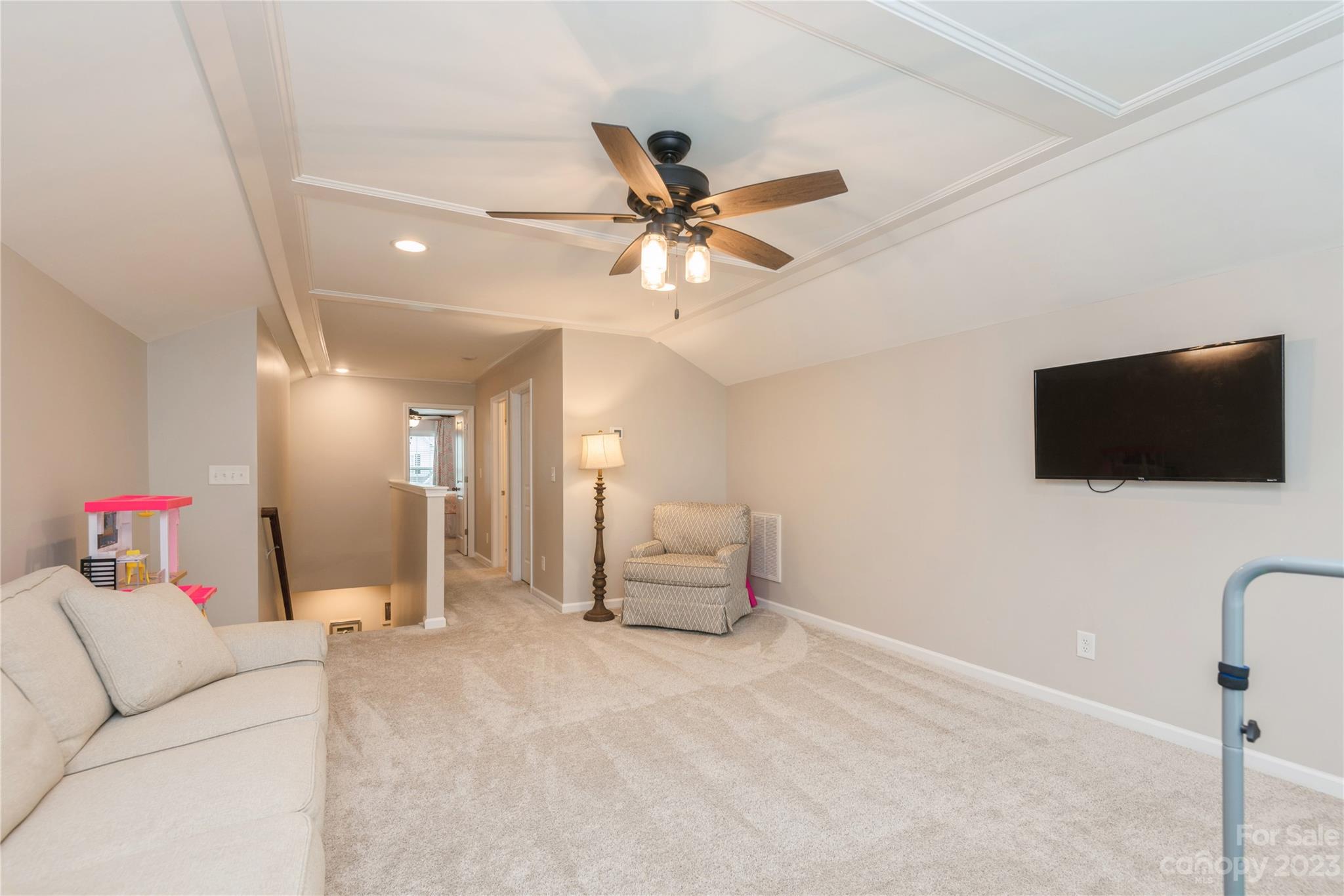 3028 Eagle Ridge Lane Indian Trail, NC 28079 - Photo 29 of 38 a living room with furniture and a flat screen tv