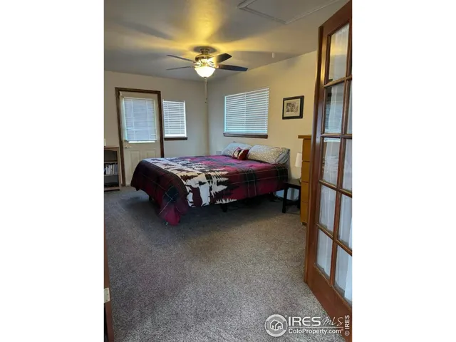 a bed room with a bed and a window